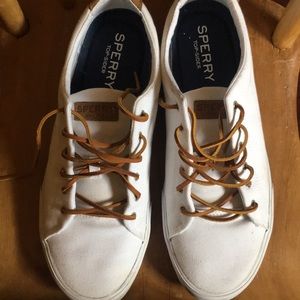 White Sperry sneaker.